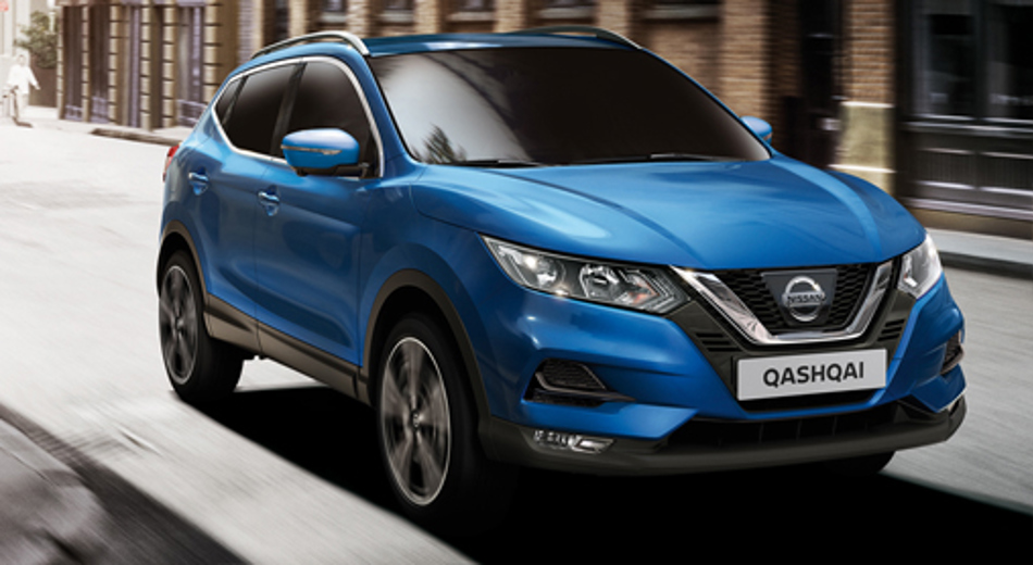 Blue Qashqai driving in street