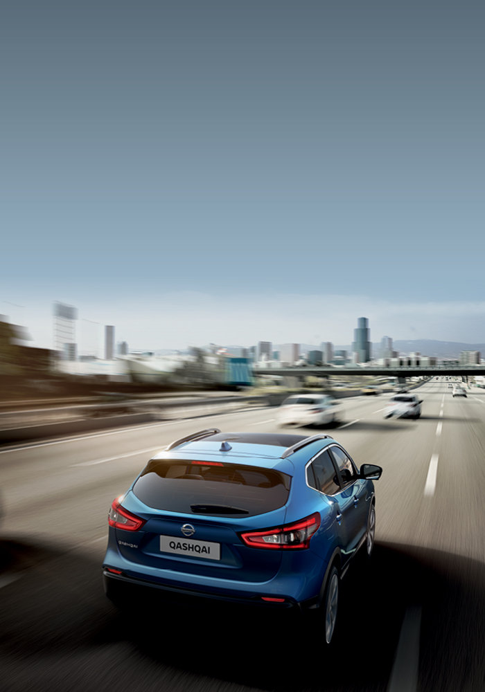 Blue Qashqai driving away